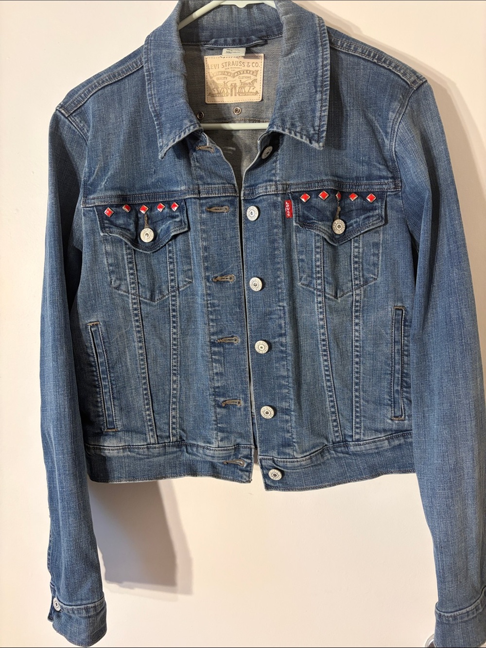 Levi's Blue Denim Trucker Jacket with Red Stud Accents